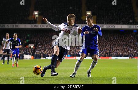 Tottenham Hotspur's Eric Dier (left) and Chelsea's Eden Hazard battle for the ball Stock Photo