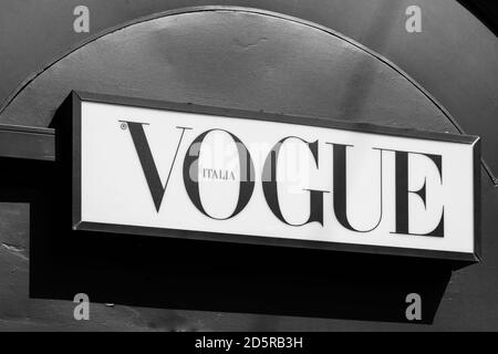 Vogue brand logo sign on a newspaper kiosk. Vogue is monthly fashion and lifestyle magazine covering many topics, including fashion, beauty, culture Stock Photo