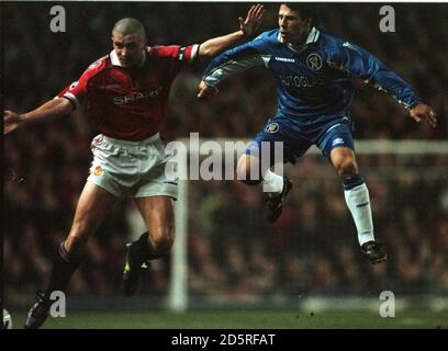 Manchester United's Roy Keane (left) and Chelsea's Gianfranco Zola (right) in action  Stock Photo