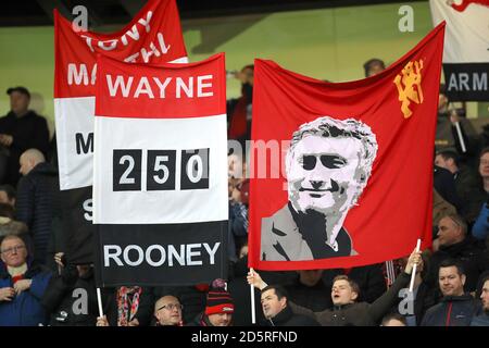 Manchester United fans hold banners in the stands  Stock Photo