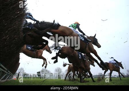 Horses jump in the Free Spins At 188Bet Casino Handicap Chase  during The Sidney Banks Go Racing Raceday 2017 at Huntingdon Racecourse Stock Photo