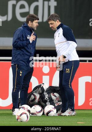 Tottenham Hotspur manager Mauricio Pochettino (left) with first team coach Miguel D'Agostino (right) Stock Photo