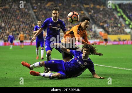 Wolverhampton Wanderers' Helder Costa (centre) and Chelsea's Nathan Ake battle for the ball Stock Photo