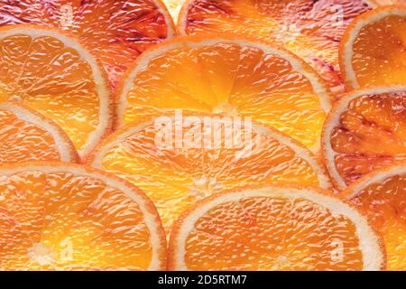 Fresh sliced orange fruit texture. Macro, top view, copy space. Juicy oranges Stock Photo