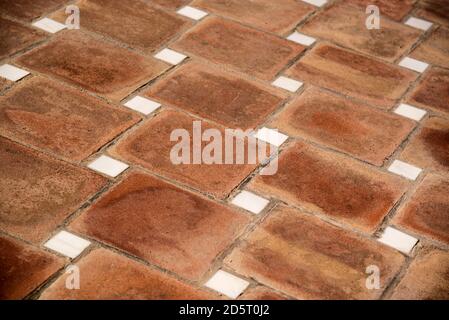 clay pavement with marble squares Stock Photo