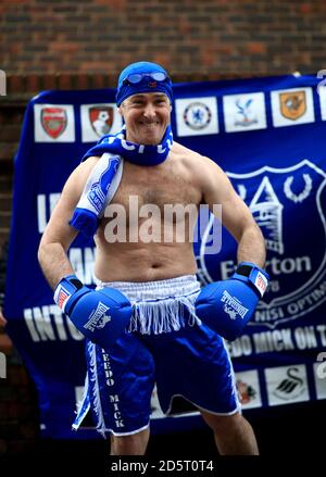 Everton fan Speedo Mick dressed in boxing gear outside the ground Stock Photo