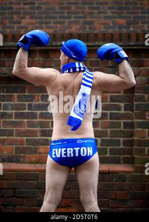 Everton fan Speedo Mick dressed in boxing gear outside the ground Stock Photo