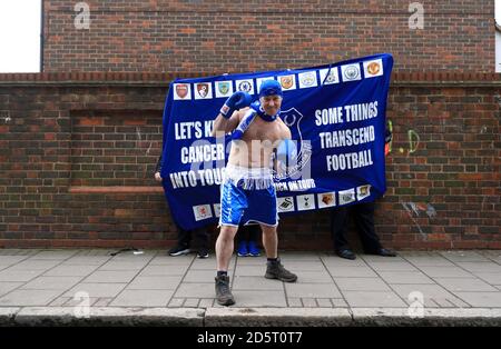 Everton fan Speedo Mick dressed in boxing gear outside the ground Stock Photo