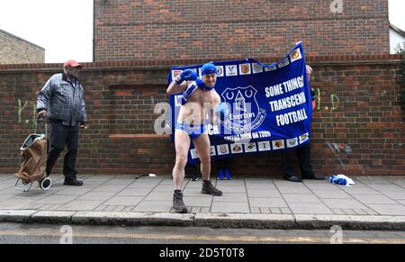 Everton fan Speedo Mick dressed in boxing gear outside the ground Stock Photo