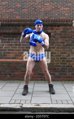 Everton fan Speedo Mick dressed in boxing gear outside the ground Stock Photo