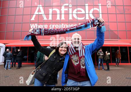 Burnley fans hold up a scarf outside Anfield prior to the match Stock Photo