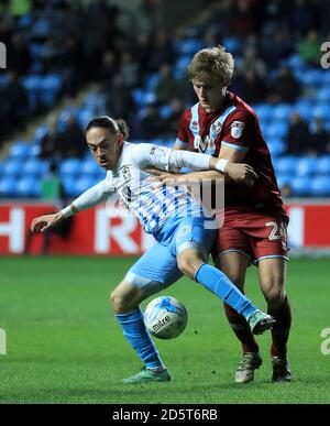 Coventry City's Jodi Jones (left) and Port Vale's Nathan Smith battle for the ball Stock Photo