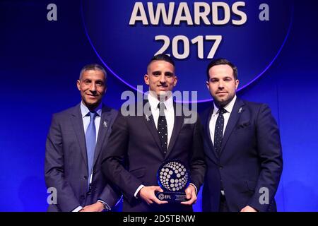 Brighton and Hove Albion's Anthony Knockaert (centre) collects the Sky Bet Championship Player of the Season Award from Brighton and Hove Manager Chris Hughton (left) at the EFL awards at the London Hilton, Park Lane. Stock Photo