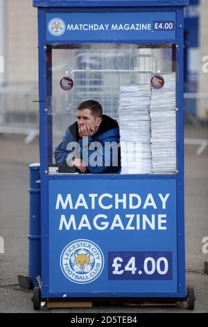 A vendor sells the match day programme during the Premier League match ...
