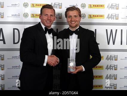 Ritchie Humphreys (left) presents Luke Berry with his divisional award winner trophy for League Two during the Professional Footballers' Association Awards 2017 at the Grosvenor House Hotel, London Stock Photo