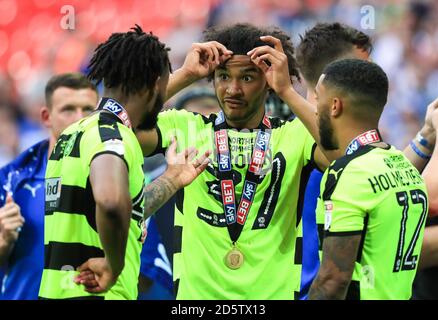 Huddersfield Town's Isaiah Brown celebrates with team mates after his side win the Sky Bet Championship play off final  Stock Photo