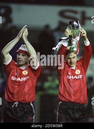 Manchester United winger Andrei Kanchelskis parades the European Super Cup at Old Trafford after they defeated Red Star Belgrade 1-0 Stock Photo