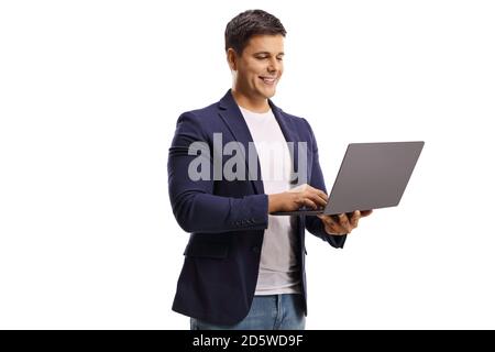 Young man standing and looking in a laptop computer isolated on white background Stock Photo