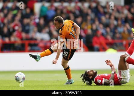 Wolverhampton Wanderers' Diogo Jota scores his 2nd goal against Nottingham Forest as defender Armand Traore looks on. Stock Photo