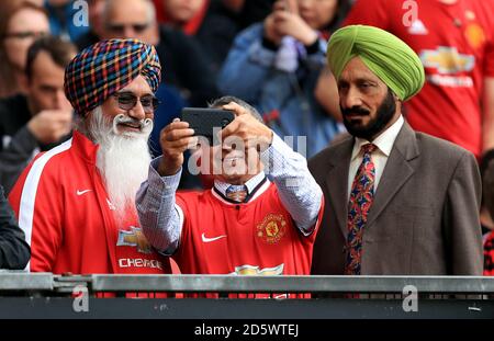Manchester United fans take a selfie in the stands Stock Photo - Alamy