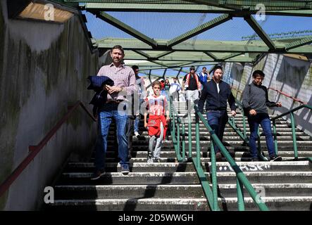 Southampton fans make their way to the stadium prior to the match Stock Photo