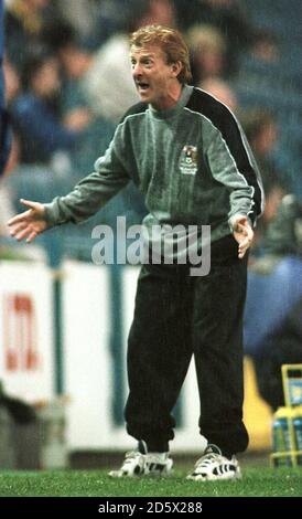 Coventry City Manager Gordon Strachan getting a soaking during the goalless draw at Sheffield Wednesday Stock Photo