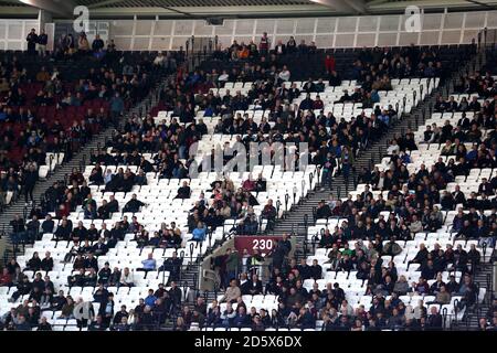 Empty seats amongst the West Ham United fans after Brighton & Hove Albion's Glenn Murray scores his side's third goal of the game Stock Photo