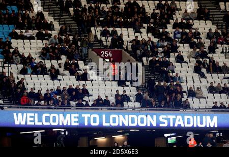 Empty seats amongst West Ham United fans towards the end of the match Stock Photo
