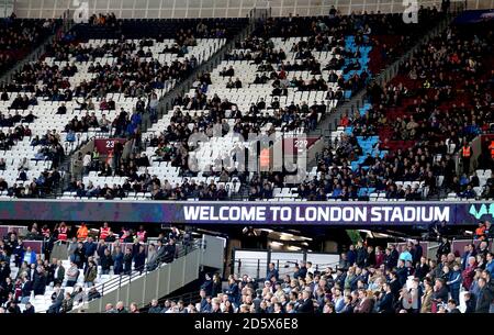 Empty seats amongst West Ham United fans towards the end of the match Stock Photo