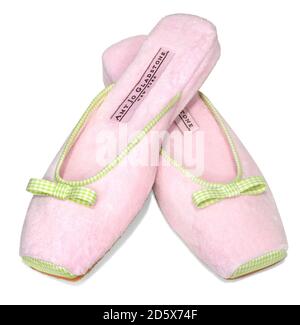 Amy Jo Gladstone pink slippers with green and white plaid bow photographed on a white background Stock Photo