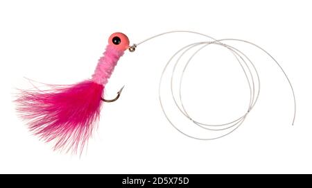 hot pink fishing lure on a fishing line photographed on a white