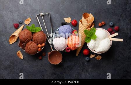 Berry, vanilla and chocolate ice cream sundae. Top view flat lay Stock Photo