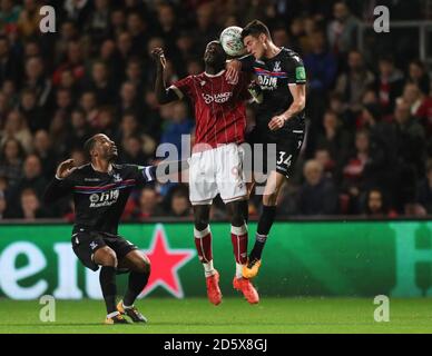 Bristol City's Famara Diedhiou and Crystal Palace's Martin Kelly (right) both jump for a header