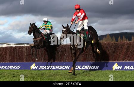 Foxtail Hill ridden by Sam Twiston-davies jumps the last with Le Prezien ridden by Barry Geraghty in the Randox Health Handicap Steeple Chase during day two of the Showcase at Cheltenham Racecourse Stock Photo