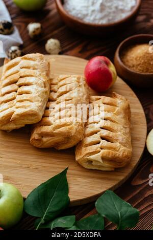 homemade Apple pies on a wooden background Stock Photo
