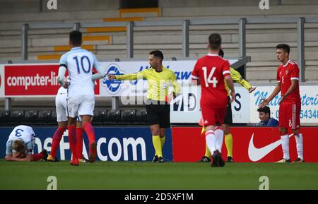 Russia's Dmitry Markitesov (right) is sent off for a foul on England's Louie Sibley (left)  Stock Photo