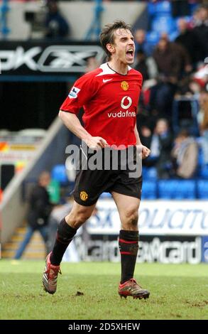 Manchester United's captain Gary Neville celebrates their victory at the end of the game Stock Photo