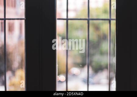 window with bars and the street in the background Stock Photo