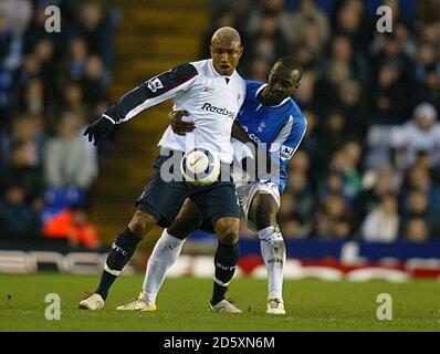 Birmingham City's Olivier Tebily challenges Bolton Wanderers' El-Hadji Diouf Stock Photo