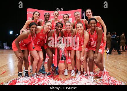 England Roses' celebrate winning against Malawi Queens' during the Vitality Netball International Series at the Genting Arena Stock Photo