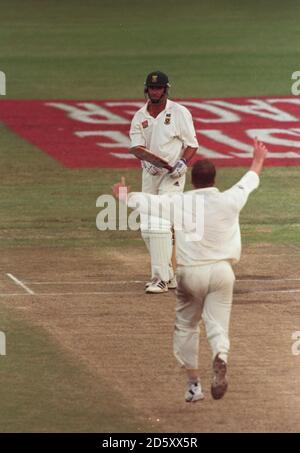 England's Andrew Flintoff celebrates claiming the wicket of the South African captain Hansie Cronje. Stock Photo