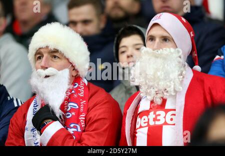 Festive Stoke City fans in the stands during the match Stock Photo