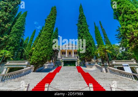 Italy, Lombardy, Gardone Riviera, Villa Alba, red carpet Stock Photo
