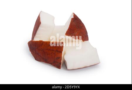 Studio shot of small pieces of coconut cut out against a white background - John Gollop Stock Photo