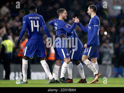 Chelsea's Eden Hazard (centre) celebrates with his team mates after scoring the final penalty against Norwich and winning the match Stock Photo