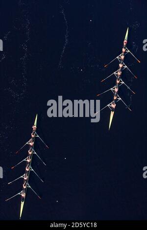 Elevated view of two rowing eights in water Stock Photo