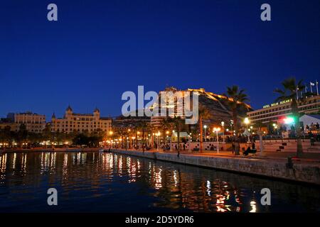 Spain, Alicante, Santa Barbara castle seen from the harbour at night Stock Photo