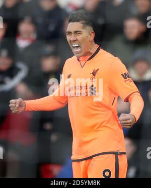 Liverpool's Roberto Firmino celebrates scoring the opening goal Stock Photo