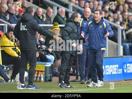 Burton Albion manager Nigel Clough remonstrates with Nottingham Forest first team coach Simon Ireland on the touchline Stock Photo