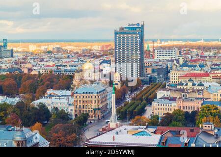 View of the city from above with The Freedom Monument and St Peter's Church, Riga, Latvia Stock Photo